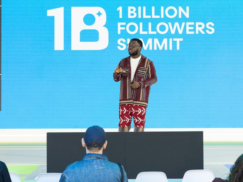 David speaking on stage at the 1 Billion Followers Summit.